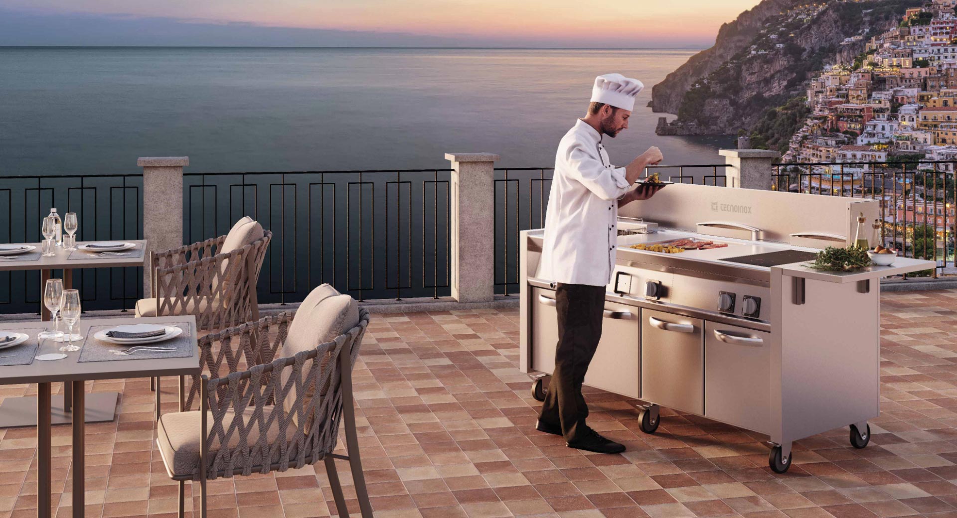 Chef che lavora su Cucina outdoor ITINERIS Tecnoinox